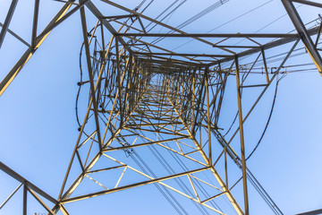 metal telegraph posts with blue sky