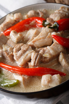 Philippine food: bicol express from a pork belly and coconut milk close-up. vertical