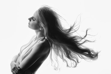 Glamour portrait of beautiful woman model with fresh makeup and romantic wavy hairstyle