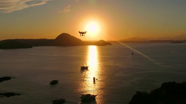 Drone pilot with high resolution camera flying over padar island in Komodo, Indonesia. zoom in	