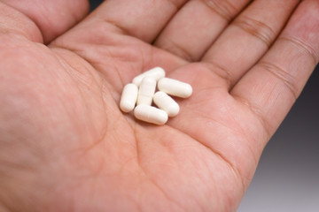 Fototapeta na wymiar pills in hand