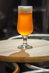 Light beer on wooden tray