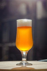 Light beer on wooden tray