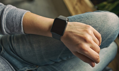 The modern smart watch on the woman's hand