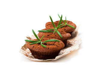 Homemade  chocolate brownies baked in muffin forms isolated in white