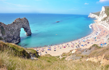 England - Durdle Door. Turqoise water in the sea and blue sky. 
