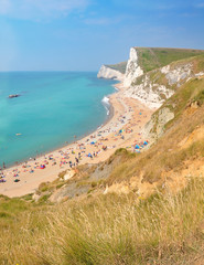 Obraz premium England - Durdle Door. Turqoise water in the sea and blue sky. 