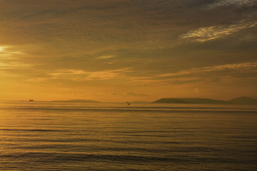 Obraz premium Beautiful panoramic sea view at islands in golden orange tones