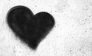 Black heart on concrete wall