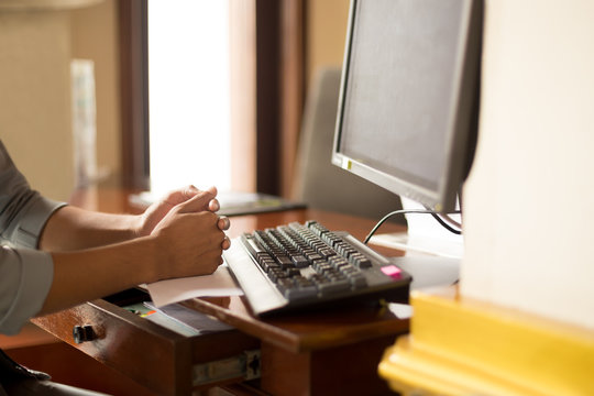 Man hand on desk sitting on front of computer
