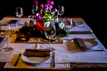 a modern table set with a floral arrangement
