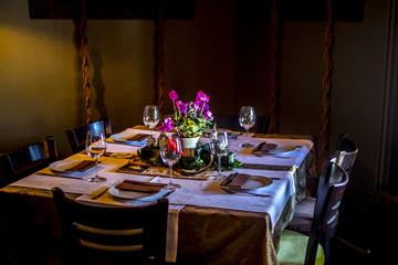 a modern table set with a floral arrangement