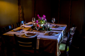 a modern table set with a floral arrangement