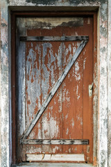 Old wooden brown house door pastel wood planks