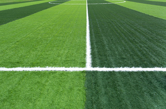 New soccer field with green artificial grass