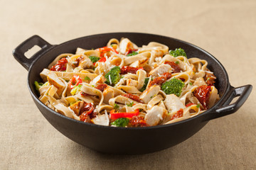 Whole-grain tagliatelle pasta with grilled chicken.