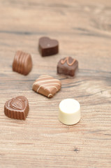 A variety of small chocolates with shallow depth of field