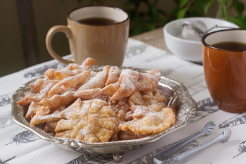 Angel wings biscuits, a traditional European sweet dish for carnival. Rustic style.