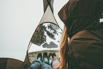 Travel couple in tent camping relaxing inside Lifestyle concept adventure vacations outdoor