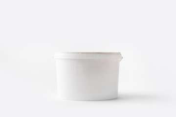 one plastic bucket with paint isolated on white