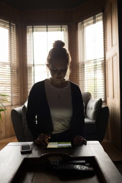 Young woman sitting on chair using her tablet