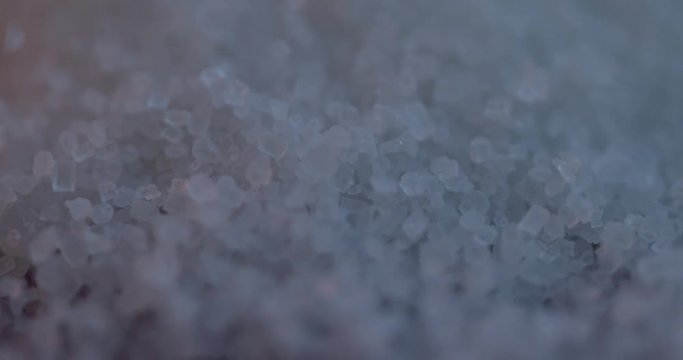 Falling sugar cane granules shot on high speed camera, phantom flex