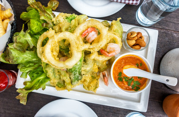 Top view of Fast food products : onion rings  and shrimp on dark table, Aerial Top View. Ready to eat.