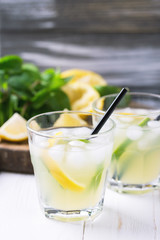 Italian lemon lime liqueur limoncello with ice and mint