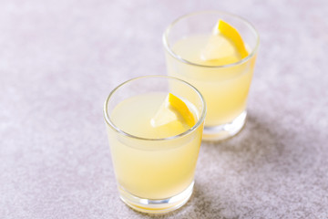 Italian lemon lime liqueur limoncello with ice and mint