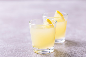 Italian lemon lime liqueur limoncello with ice and mint