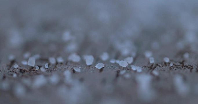 Falling sugar cane granules shot on high speed camera, phantom flex