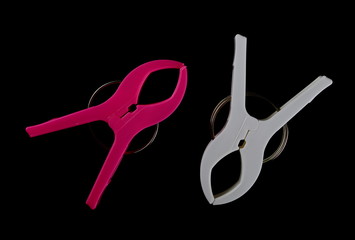 Plastic clothespins isolated on white background