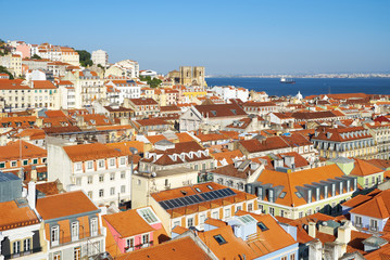 Fototapeta na wymiar The residential houses of Alfama with Tejo river on the background. Lisbon. Portugal
