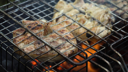Barbecue with delicious grilled meat on the grill.Barbecue meat is fried grill grate.Grilled meats outdoors.Barbeque on the grill