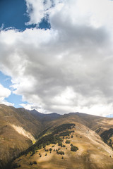 Amazing Landscape. Trees, Mountains, Clouds And blue sky