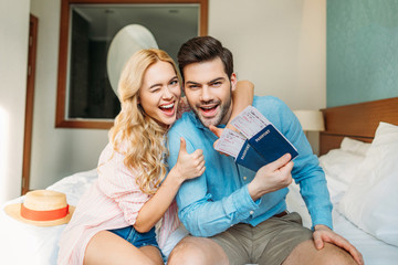 girlfriend hugging boyfriend and showing thumbs up