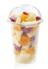 fresh fruit pieces salad in plastic cup