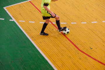 Football player on field, Futsal ball field in the gym indoor, Soccer sport field