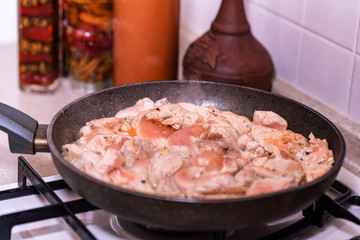 Close up chicken fillet on frying pan