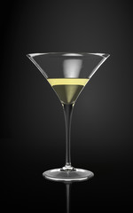 Cocktail in a martini glass on a black surface