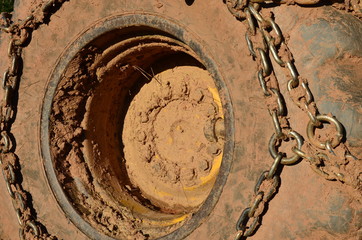 Tractor wheels with chains and mud