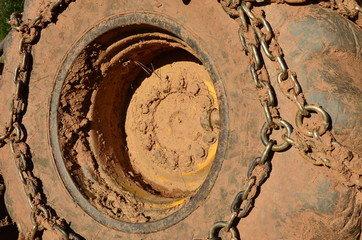 Tractor wheels with chains and mud