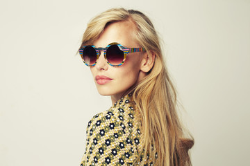 Fototapeta premium Stunning blond in shades looking over shoulder