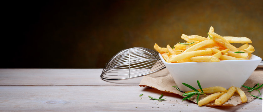 French fries, chips and colander. Space for text