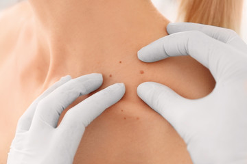 Oncologist examining female patient, closeup. Cancer awareness