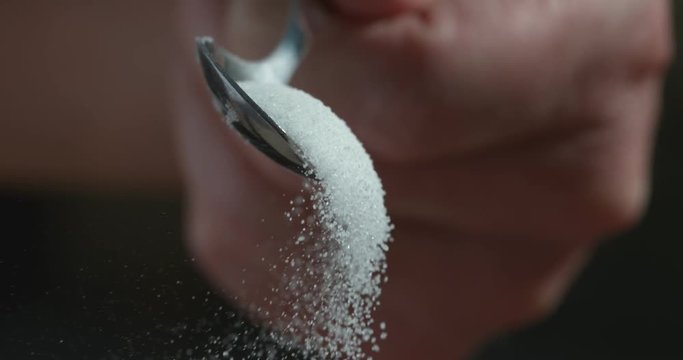 Sugar falling from spoon in super slow motion shot on Phantom Flex 4K
