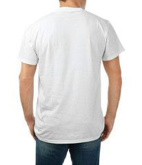 Young man in stylish t-shirt on white background. Mockup for design