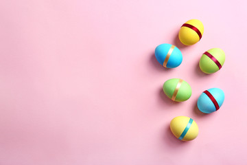 Decorated Easter eggs on color background