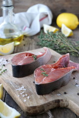 Steaks of raw red fish with spices and lemon 