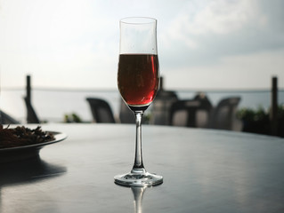 Red wine glass with beautiful sea view in Phuket Thailand